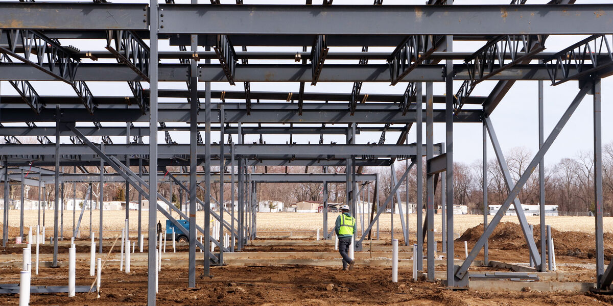 A CANCO field supervisor walks the site of an elementary school addition project that was completed ahead of schedule.