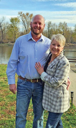 <b>Dan and his wife, Kris, outside their home along the Mississippi River. </b><i>Photo provided</i>